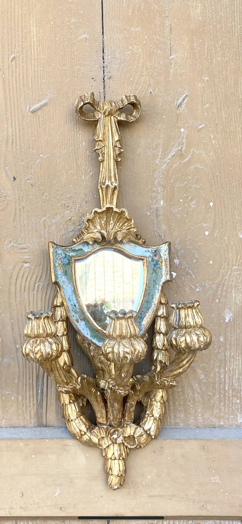 Pair of carved wood sconces