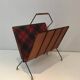 Magazine rack in black lacquered metal, leather and checkered fabric