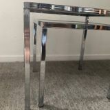 Pair of nesting tables in chromed metal and glass