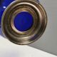Beautiful blue glass bowl mounted on silver colored base (Original).