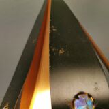 Hanging lamp in thin metal pieces, copper colored and black with prisms.