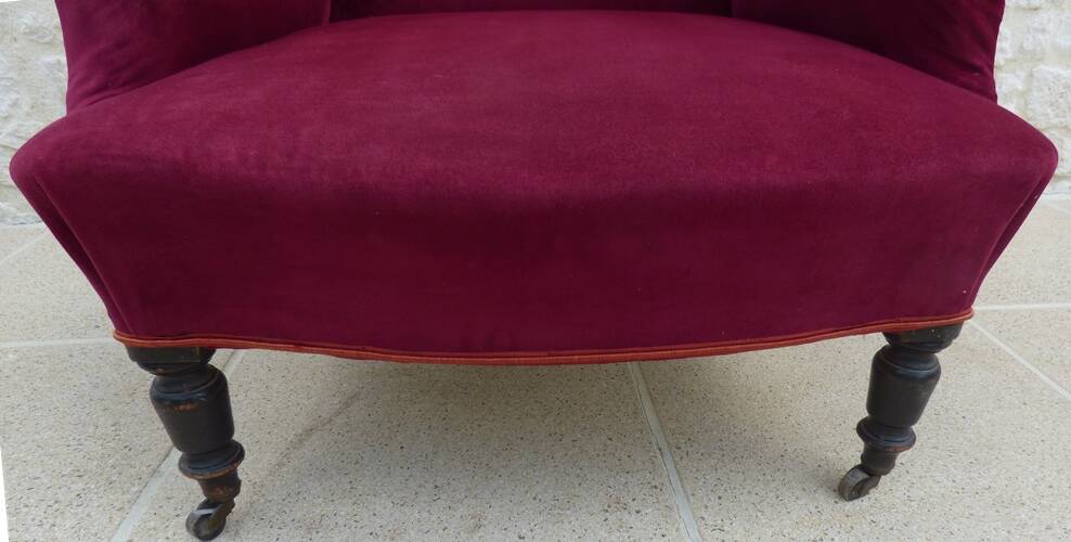 Bergère with blackened wooden legs on casters, Napoleon III period, velvet upholstery