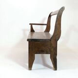 Handcrafted wooden bench with armrest and drawer on the right.