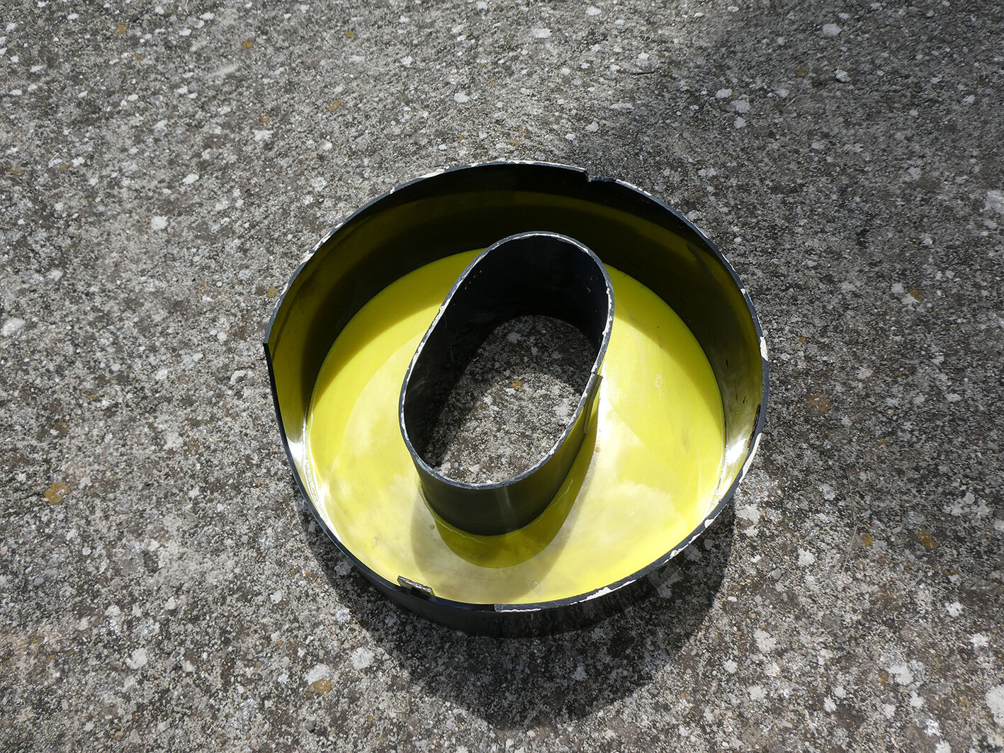 Letter "O" of industrial sign yellow and black