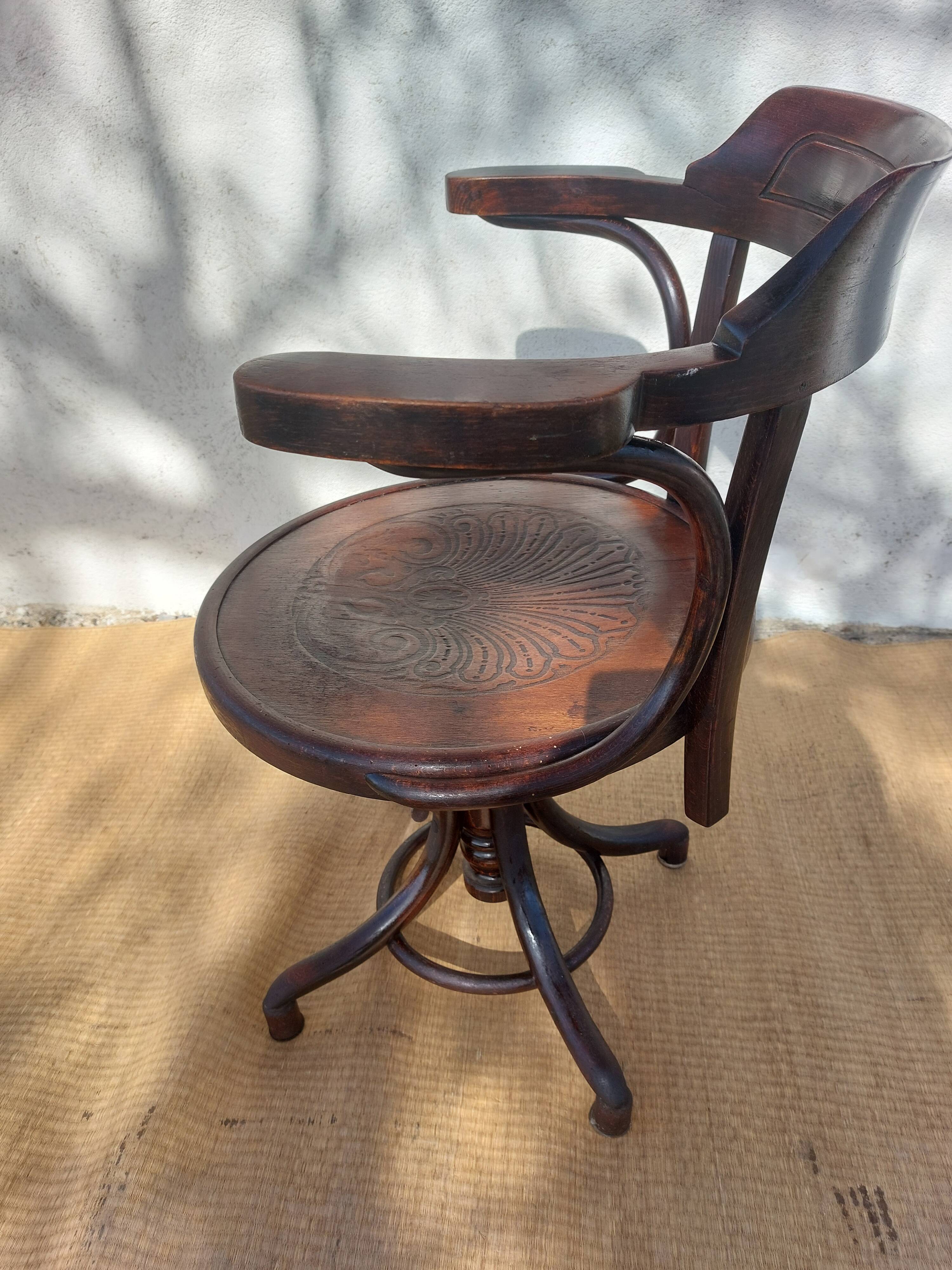 Swivel wooden armchair, pattern on seat