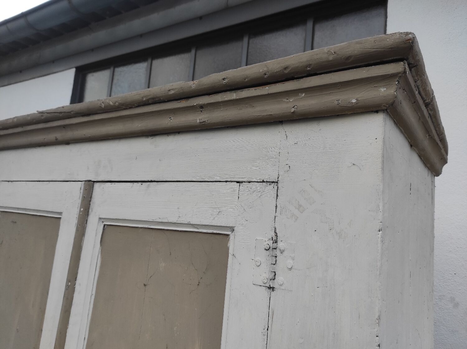 Old rustic Parisian wardrobe patinated in oak and fir