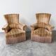 Pair of sculptural Hollywood Regency lounge chairs with original fringed upholstery