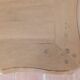 Solid wood desk with distressed white paint.