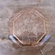 Art Deco plate in moulded pressed glass with a daisy pattern.