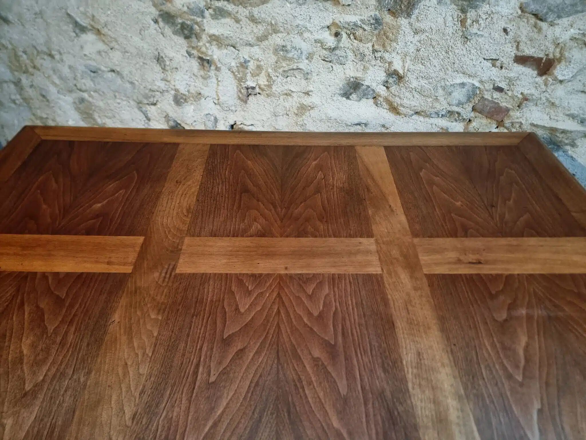 Antique French walnut table with six drawers, parquet top, early 20th century.