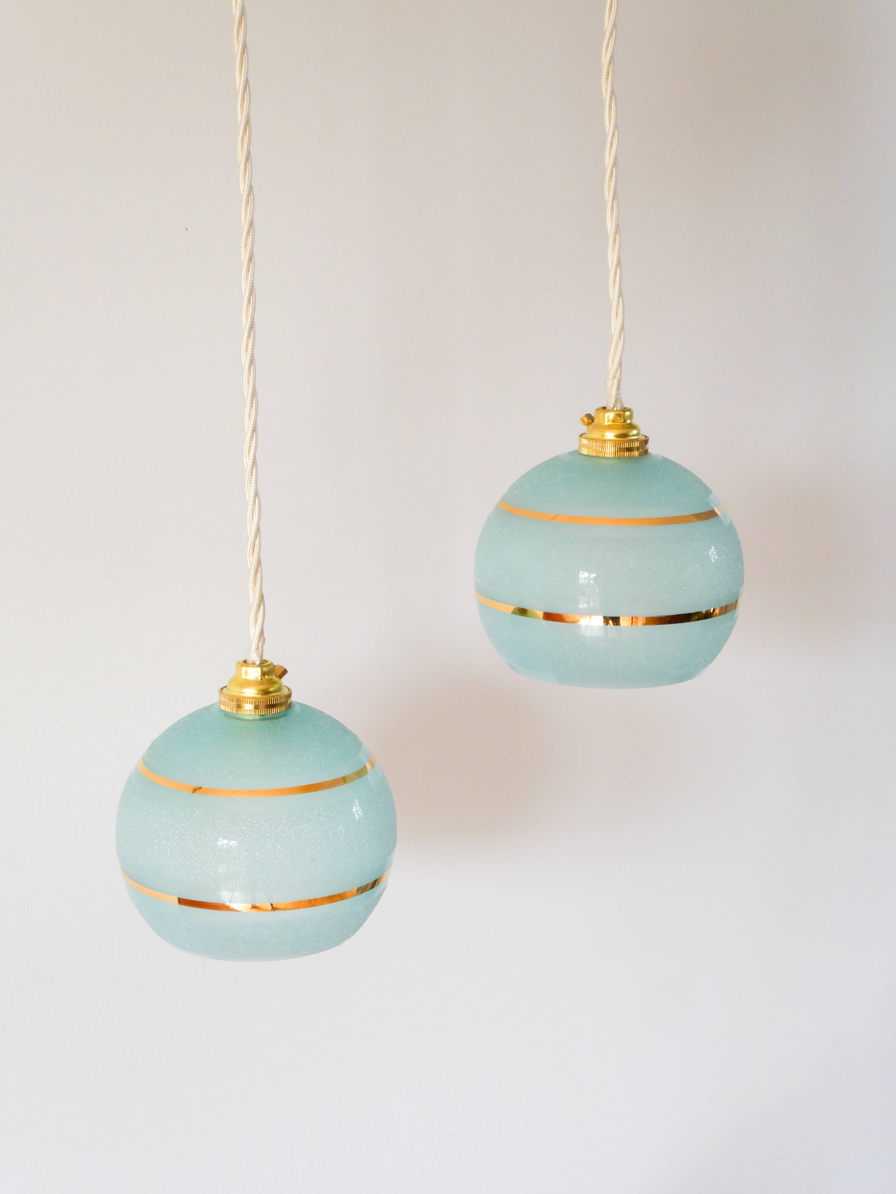 pair of blue and gold granite ball pendants 1950
