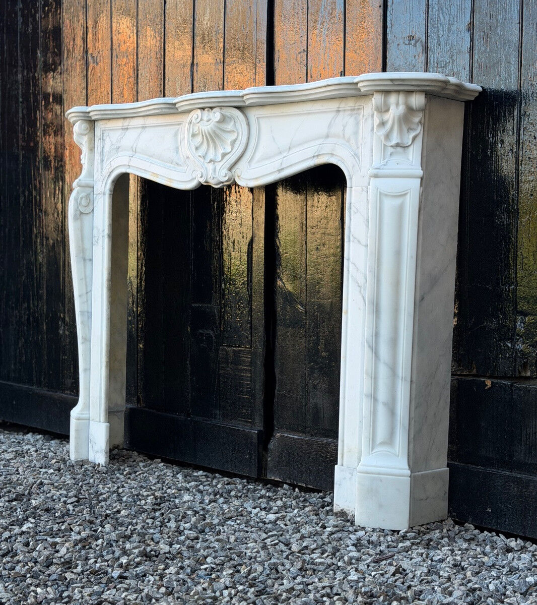 Louis XV style fireplace in Carrara marble, around 1900.