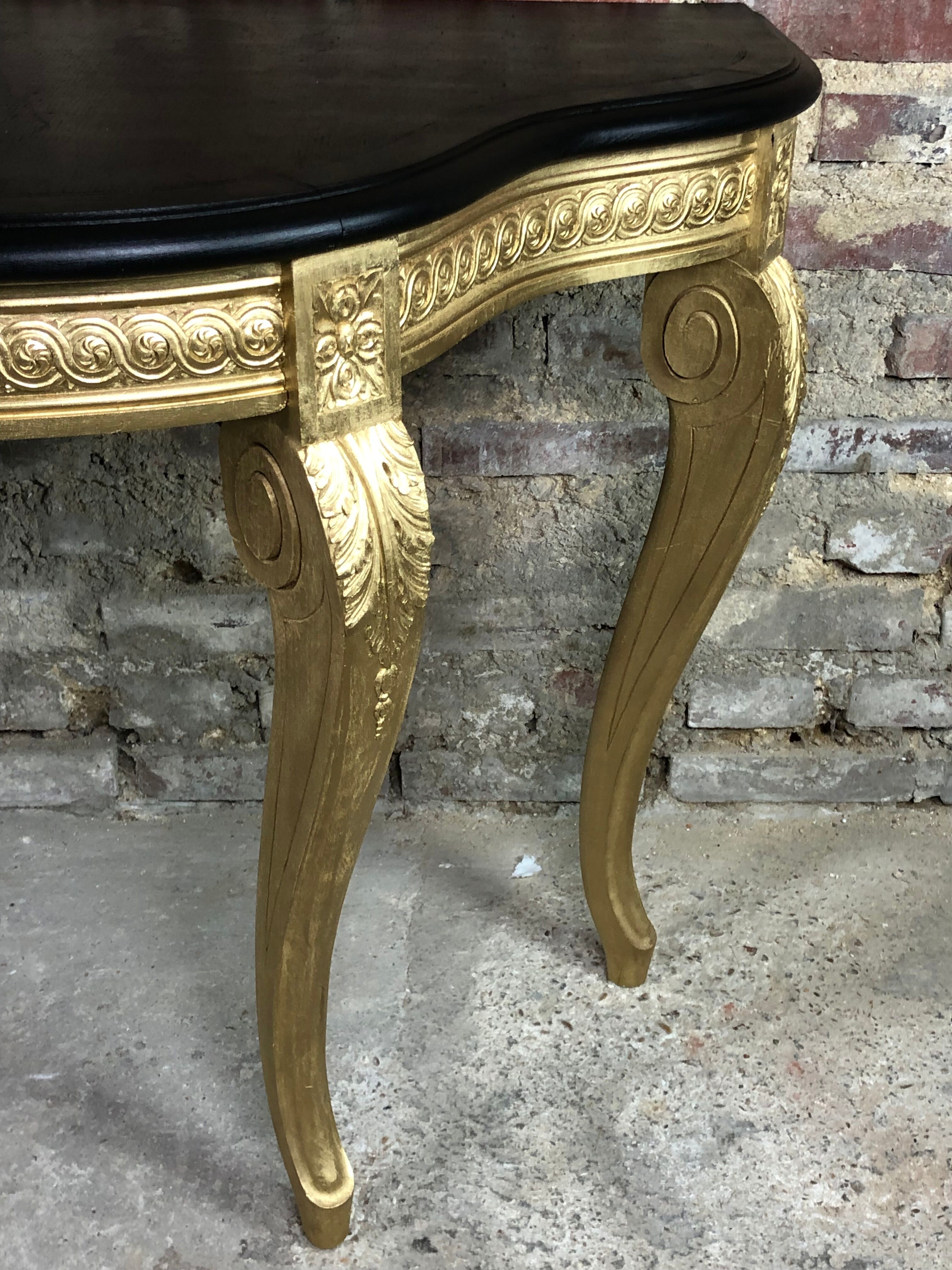 Louis XV style console in carved wood with waxed black wood top