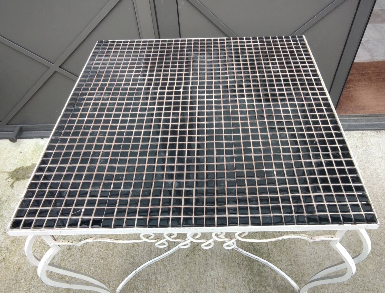 Old wrought iron table / ceramic tile top