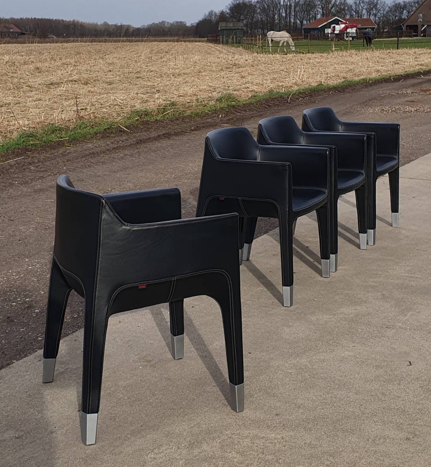 4 black armchairs Plank Claudio Bellini Mon Ami