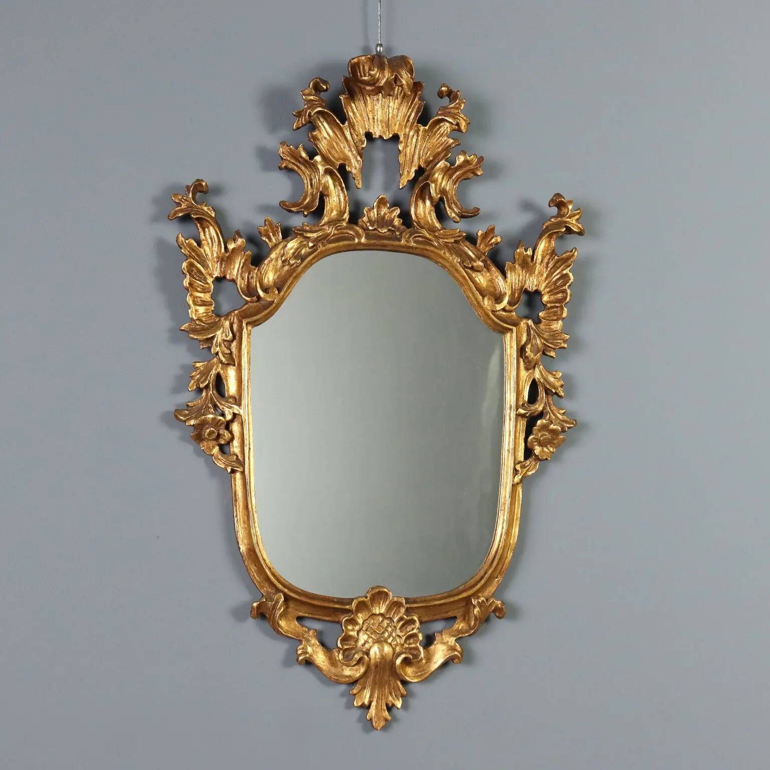 Antique carved and gilded wooden mirror, Italy, late 19th century.