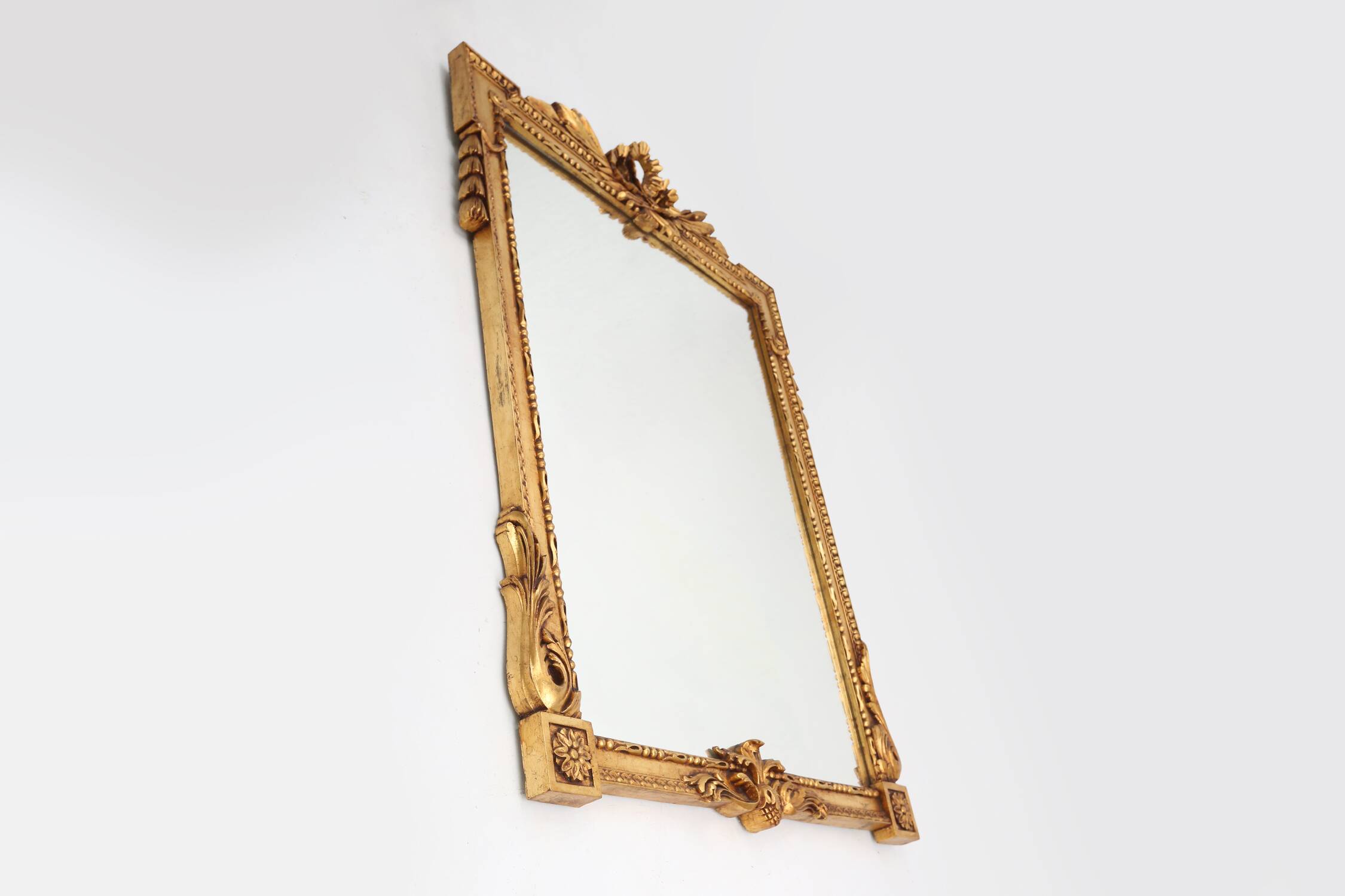 Highly decorated gilted carved wooden wall mirror, Belgium ca. 1950