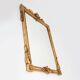 Highly decorated gilted carved wooden wall mirror, Belgium ca. 1950