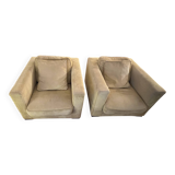 Two yellow Roche Bobois Longislande armchairs.