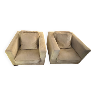 Two yellow Roche Bobois Longislande armchairs.