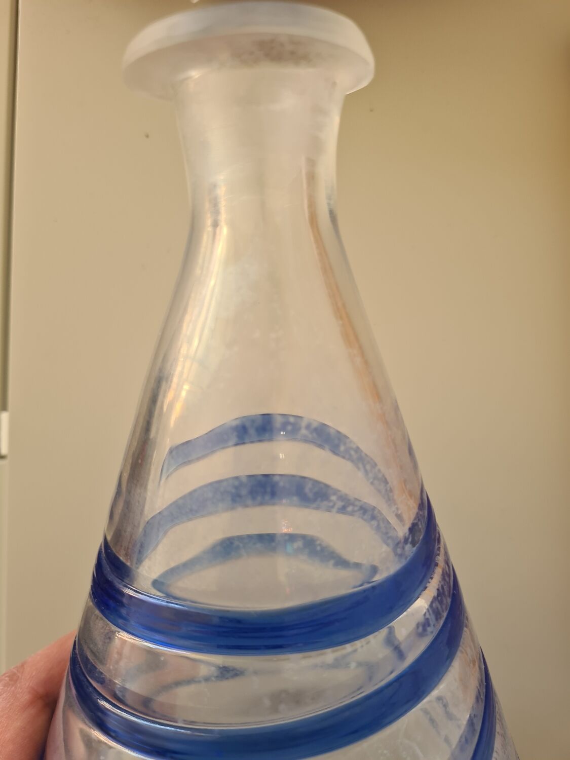 Conical glass vase/carafe blown with a blue spiral decoration.