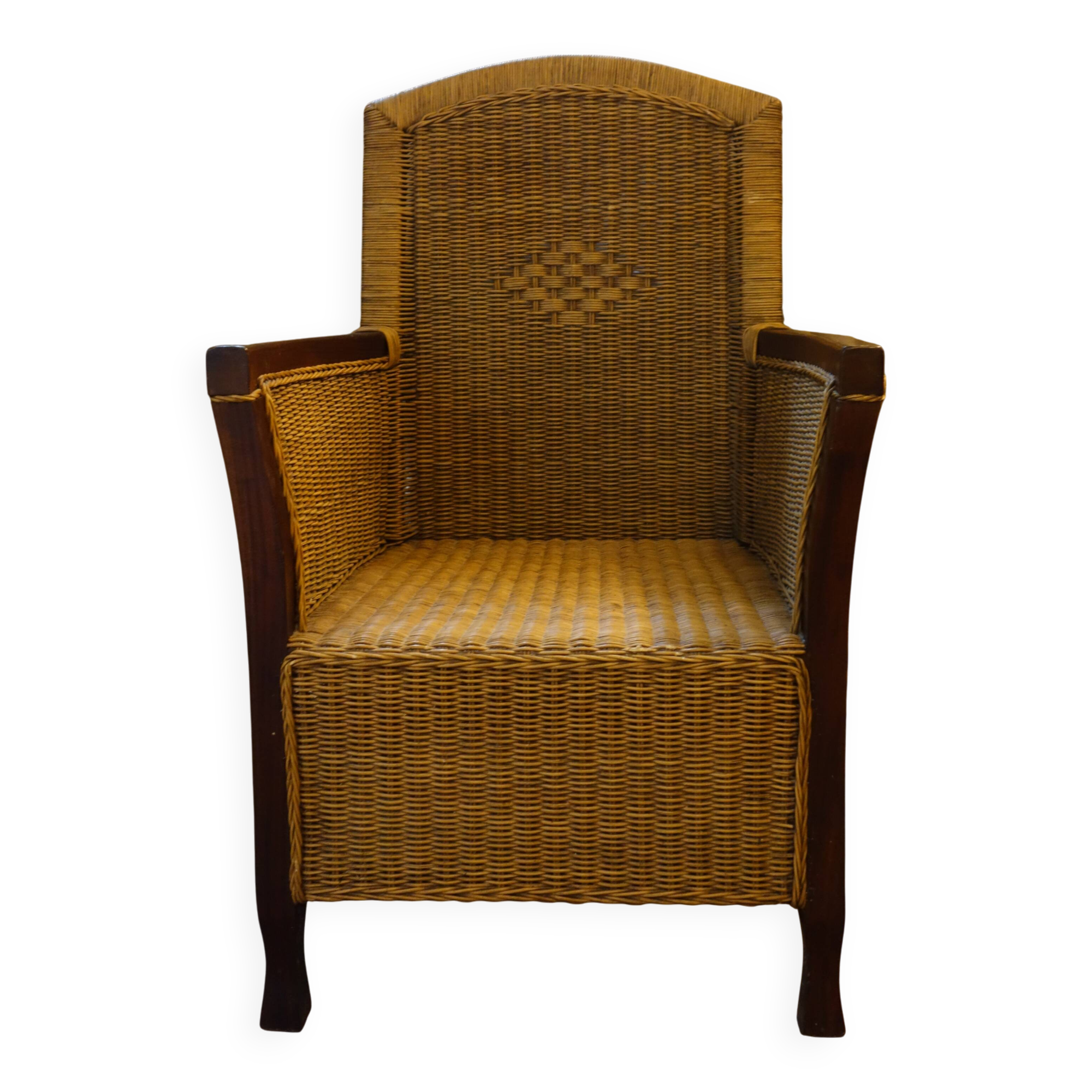 comfortable colonial-style armchair in rattan and mahogany