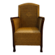 comfortable colonial-style armchair in rattan and mahogany