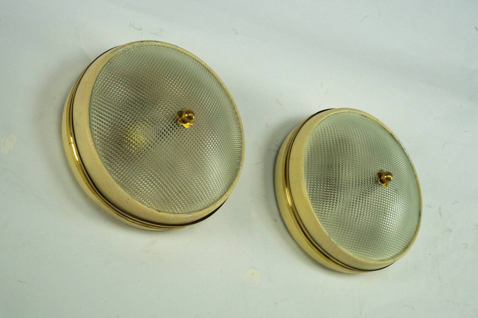 Lumi Milano, pair of wall or ceiling lamps in glass, brass and lacquer, 50s