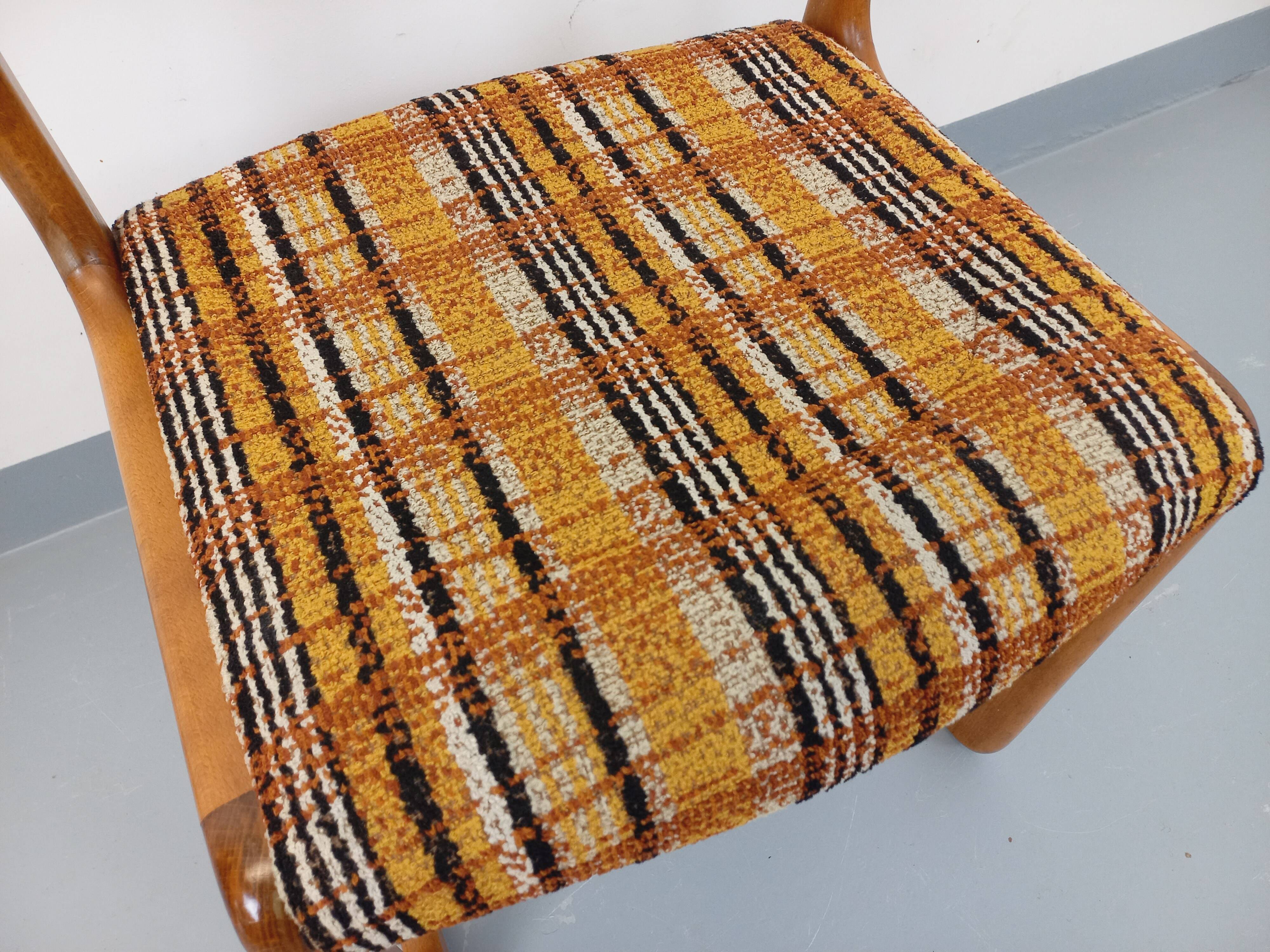 Vintage sled chair by Baumann in wood and wool fabric.