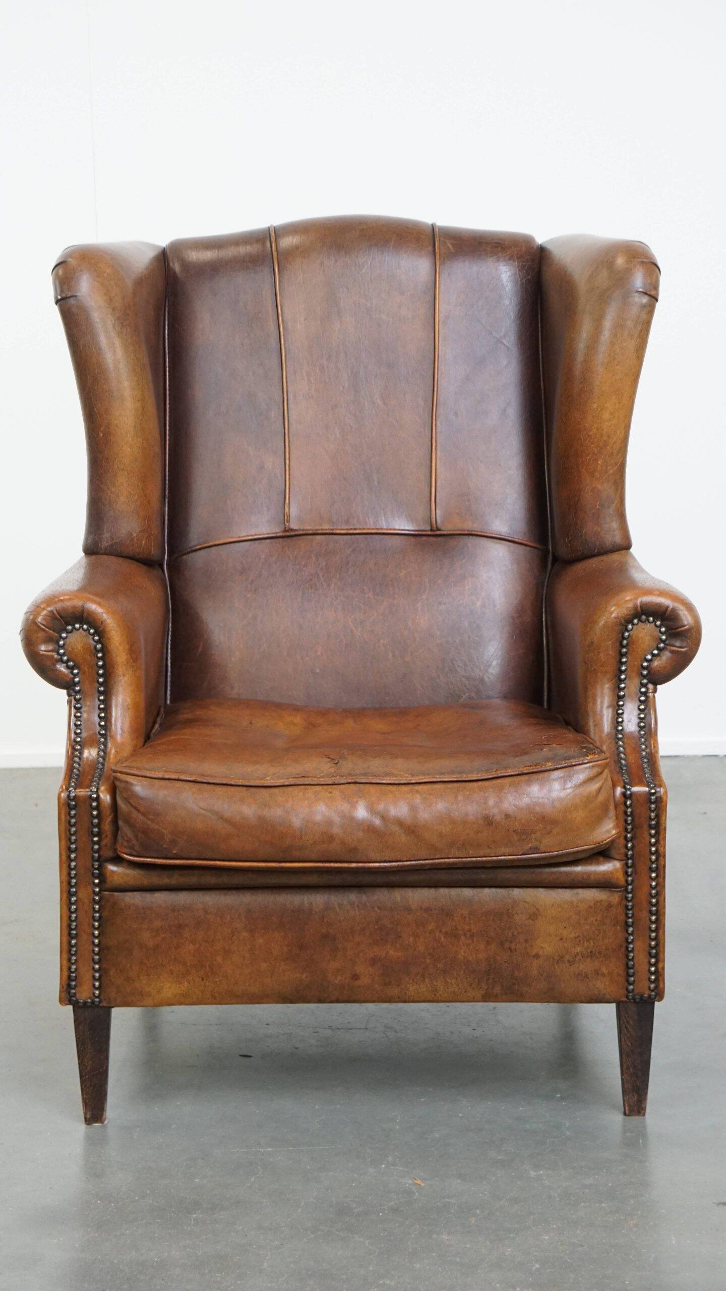 Sheepskin wingback chair in good condition