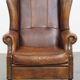 Sheepskin wingback chair in good condition