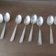 Box of 8 small art deco spoons in silver metal