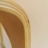 Design stool/side table made of curved plywood.