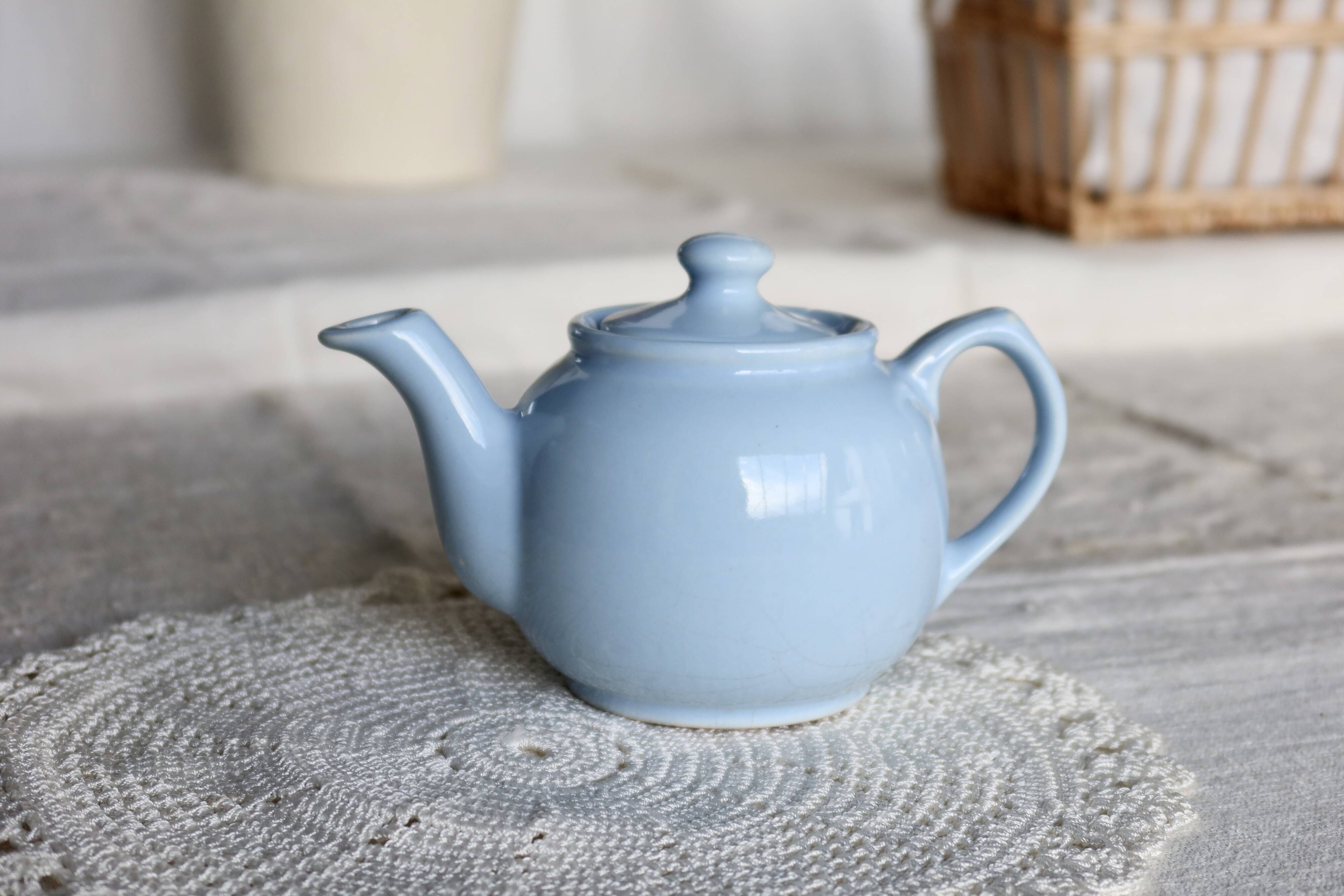 Small vintage sky-blue earthenware teapot