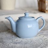 Small vintage sky-blue earthenware teapot