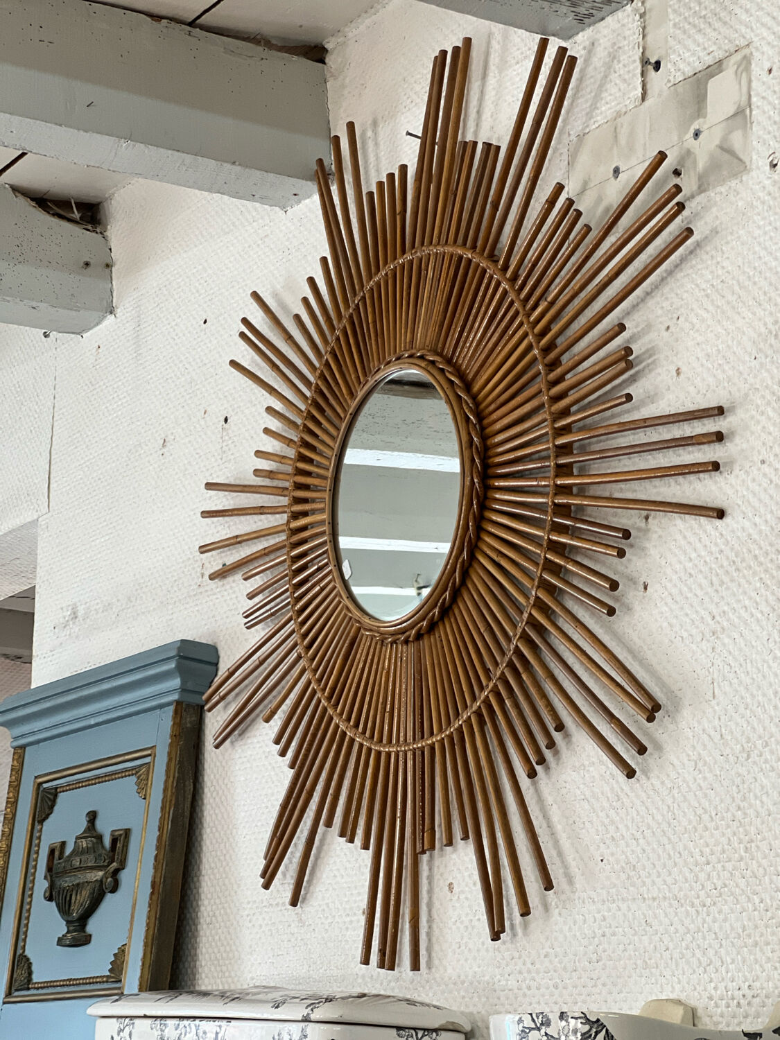 Large sun mirror in rattan