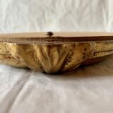 Old small wall mirror in golden resin