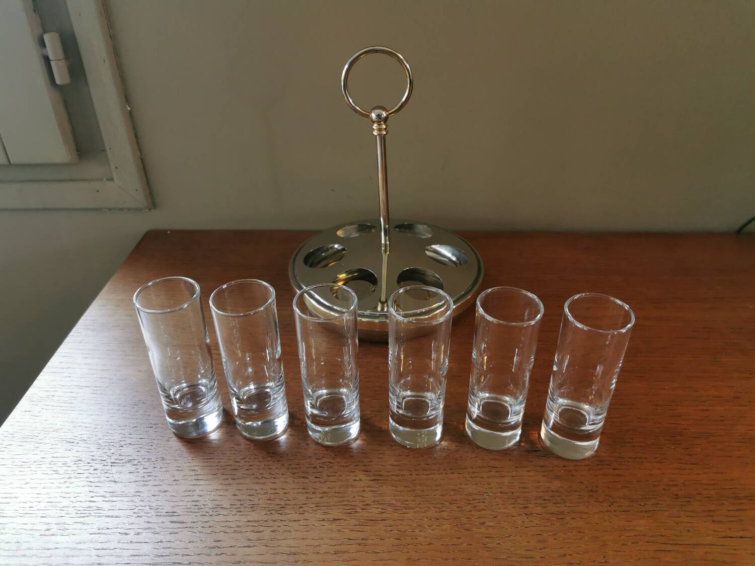 6 shot glasses on vintage metal support