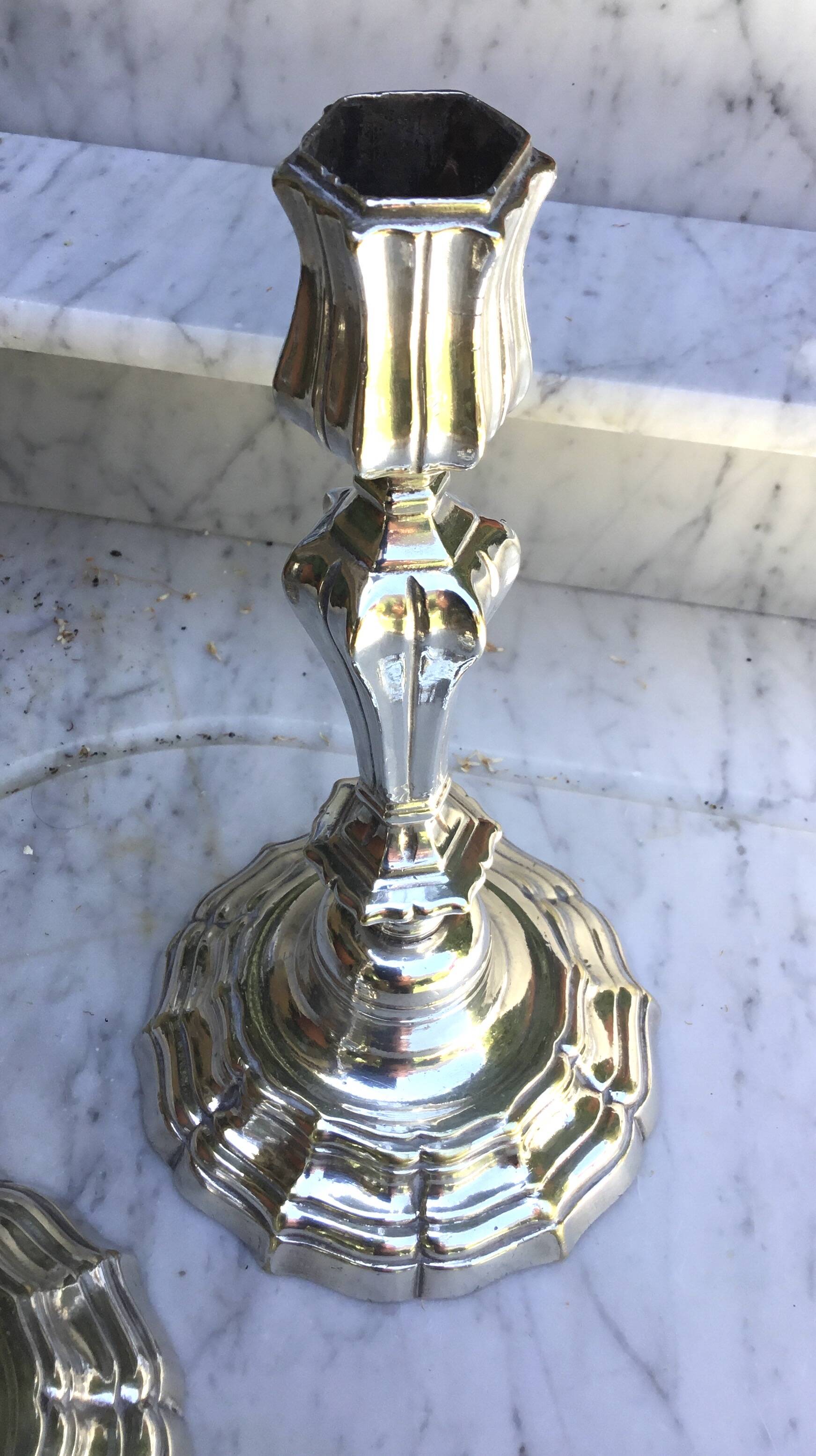 Pair of silvered metal candlesticks in the Louis XIV style.
