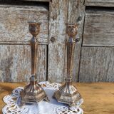 Pair of chiseled metal candle holders