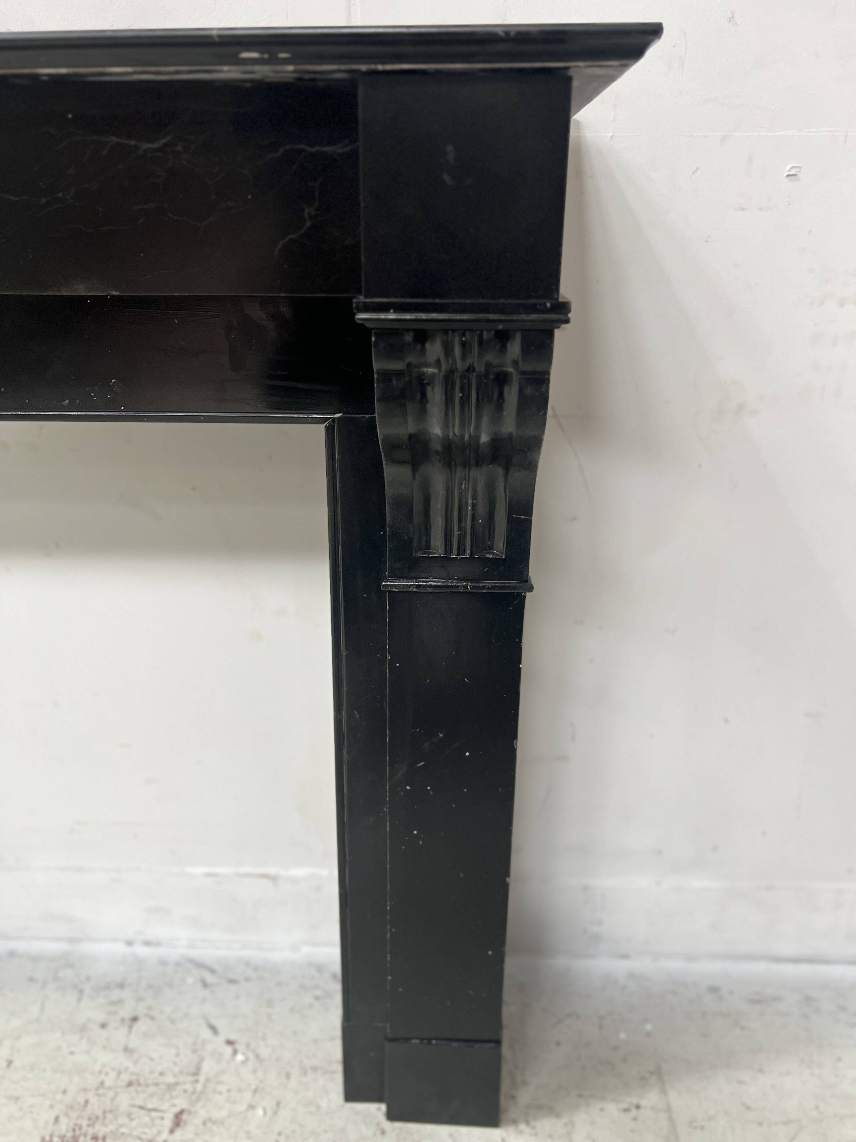 Napoleon III period fireplace with a black marble corbel. 19th century.