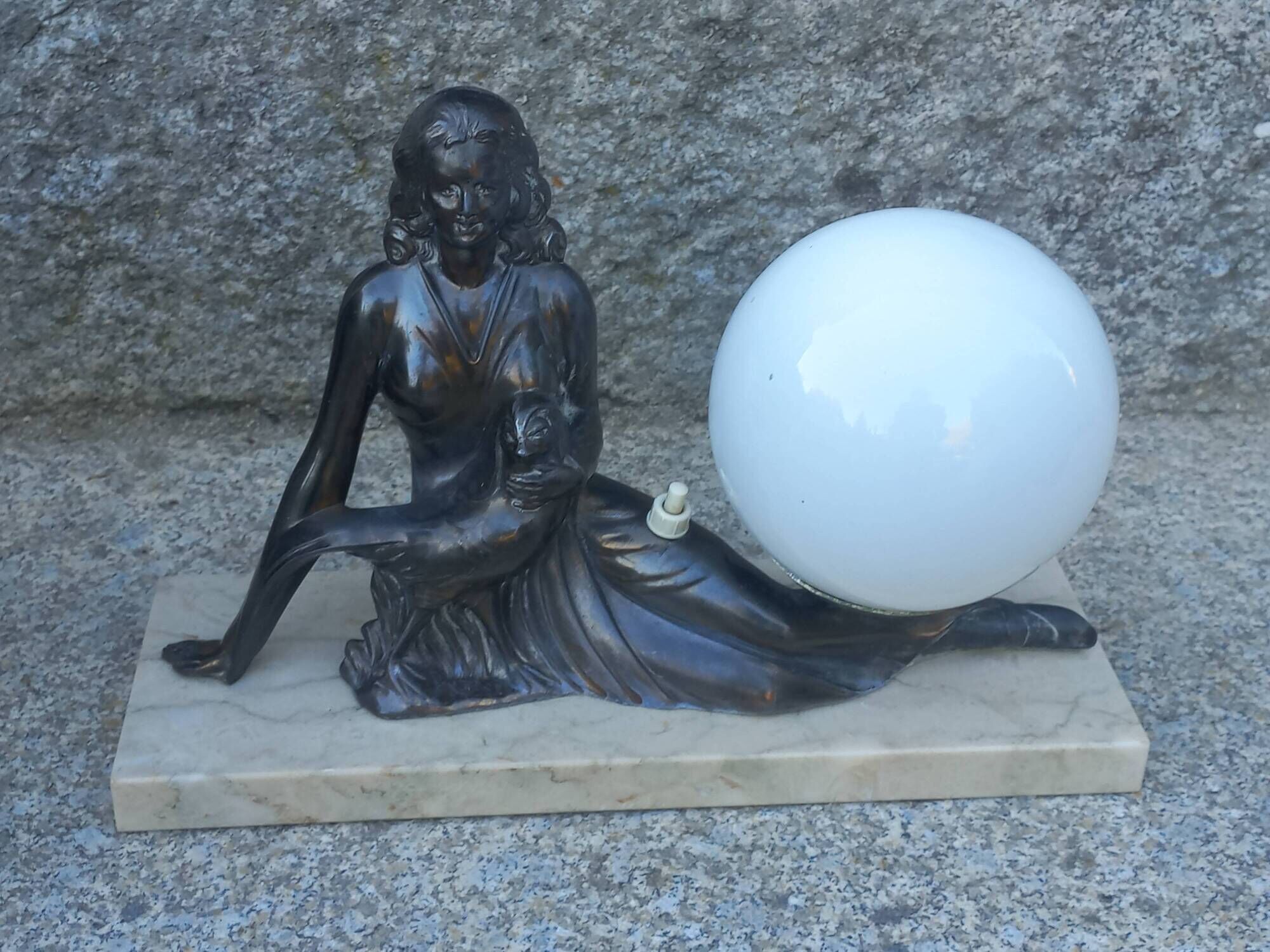 Art Deco lamp in cast iron and marble with a white opaline globe.
