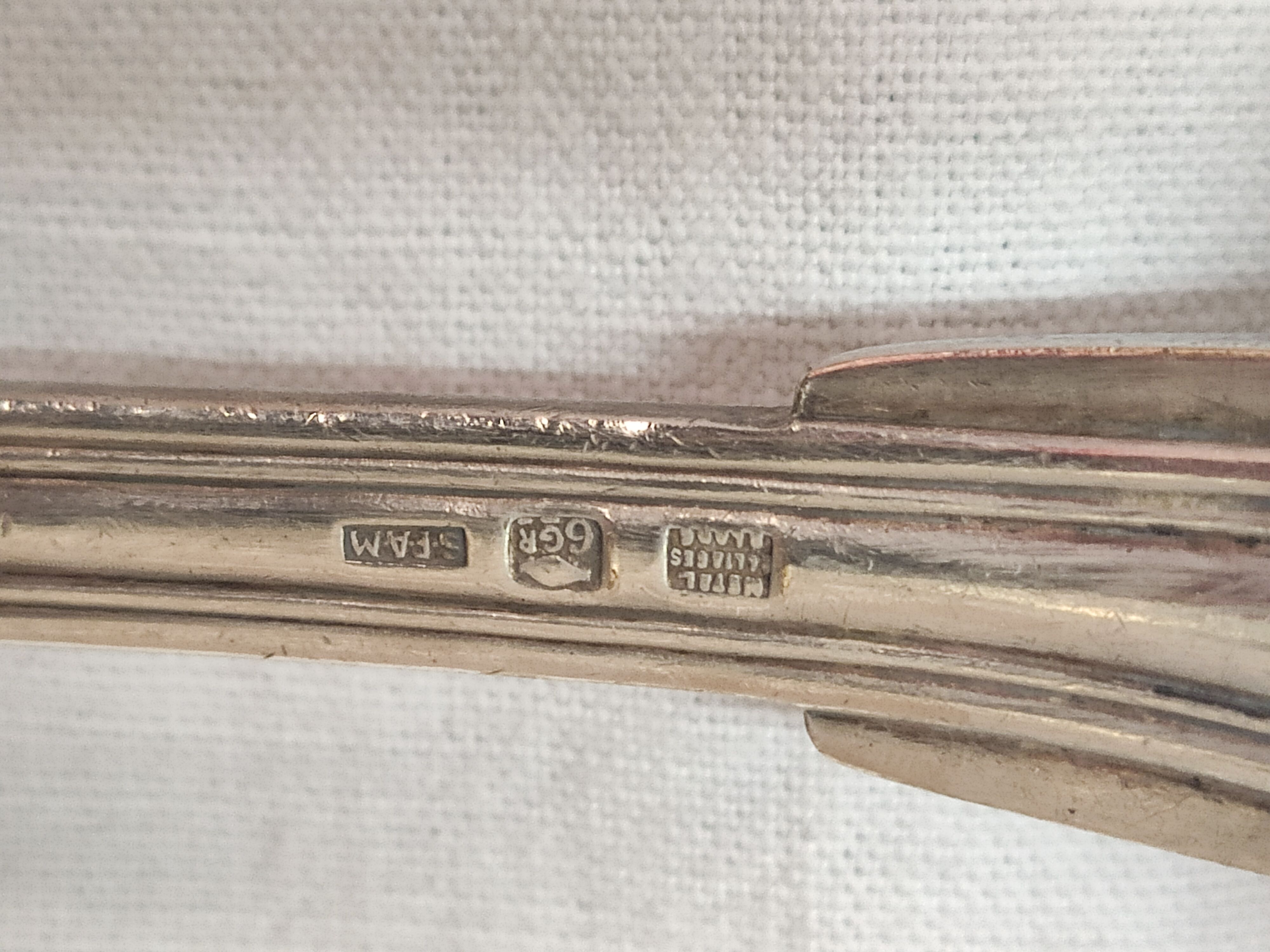 Serving spoon, silver metal.