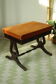 Lyre-legged stool with storage, lion paw feet, English style.