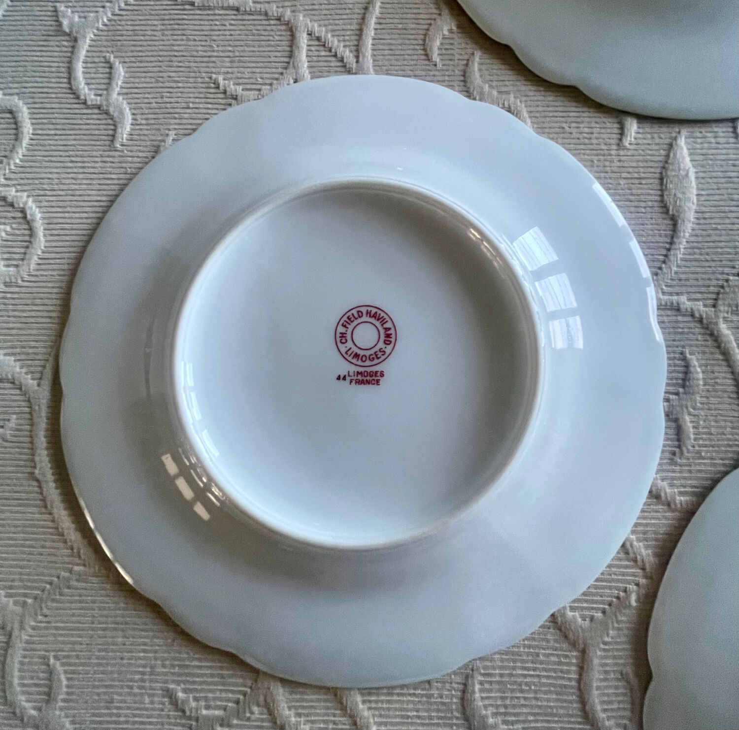 12 Haviland Limoges dessert plates.