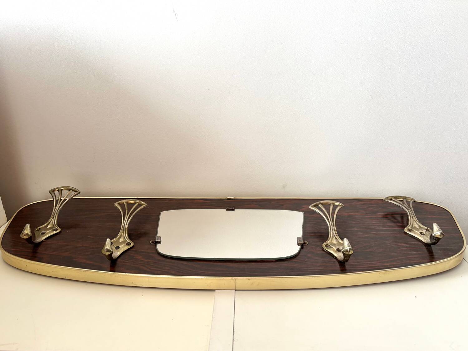 Wood and brass coat rack, 1960