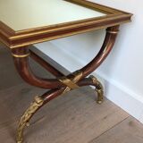 Coffee table in patinated and gilded carved wood with mirror top