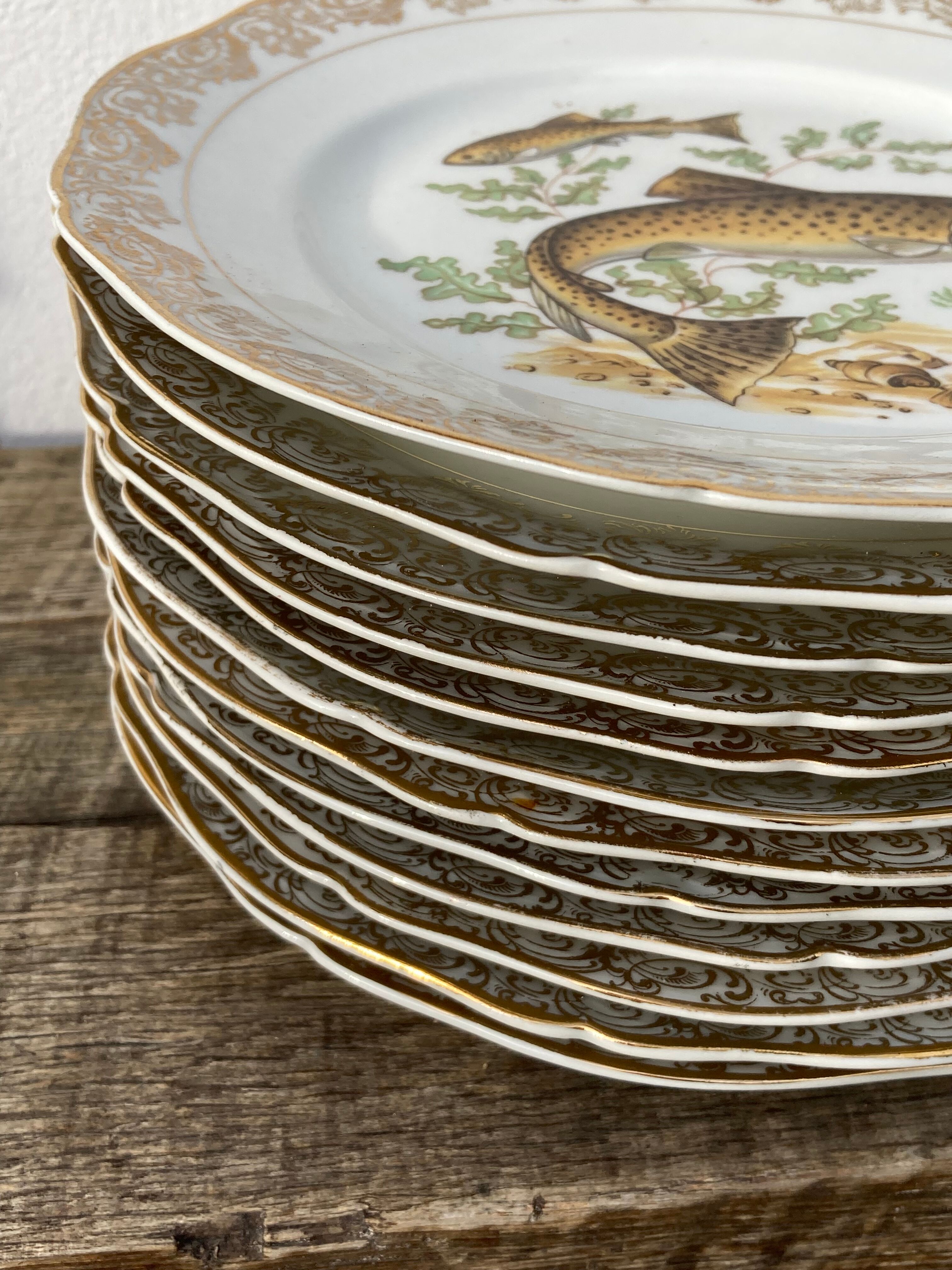 11 vintage Limoges porcelain fish plates