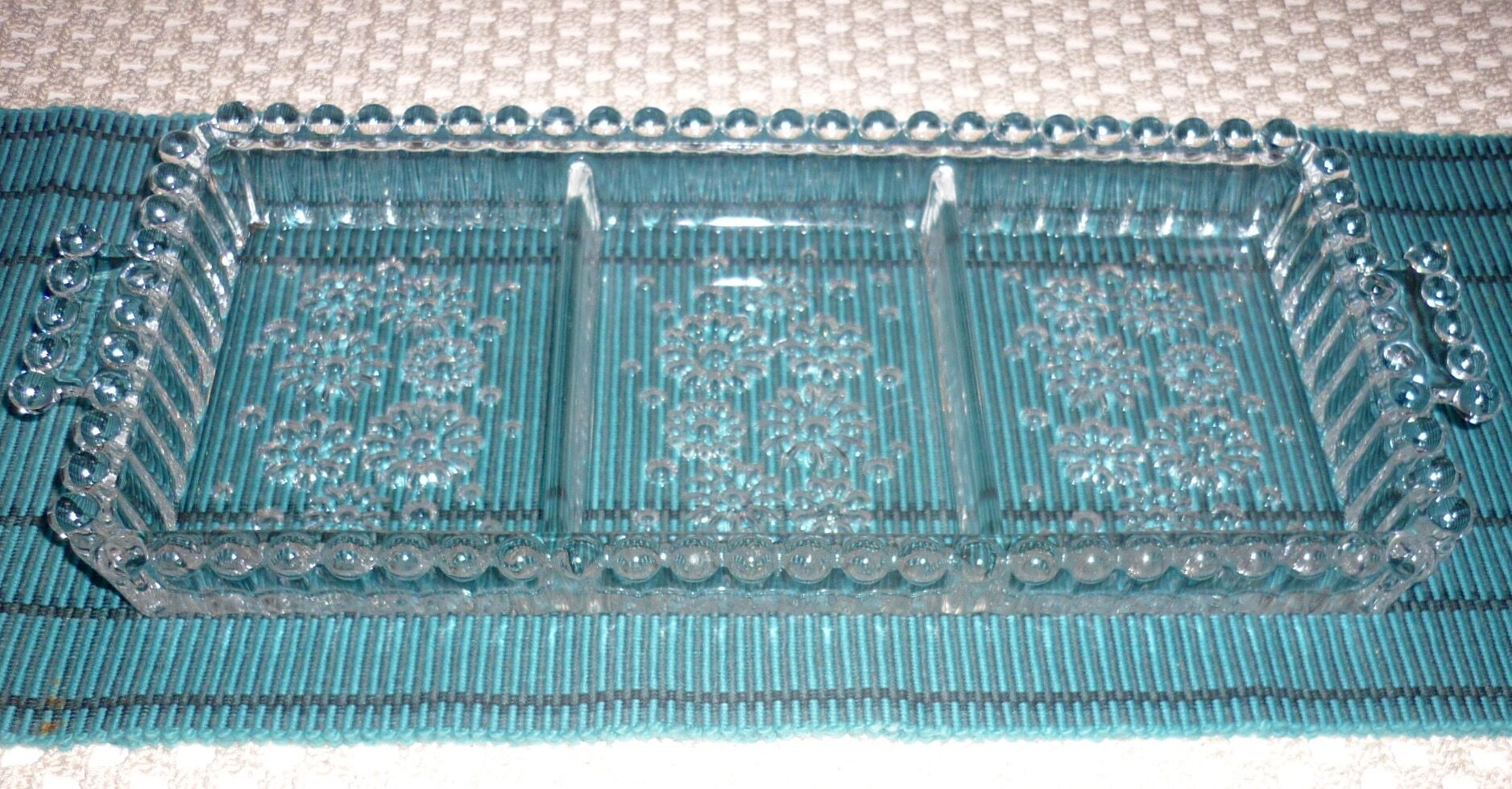 Antique dish in chiseled glass with pearls