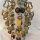Large antique vase with relief decorations of coloured fruits.